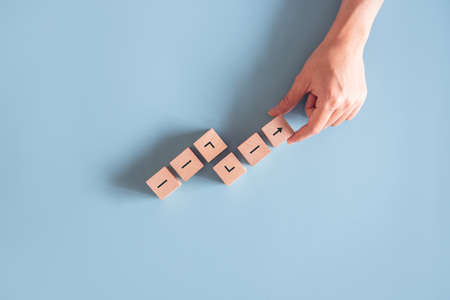 Business concept growth success process, Close up Woman hand arranging wood block stacking as step...