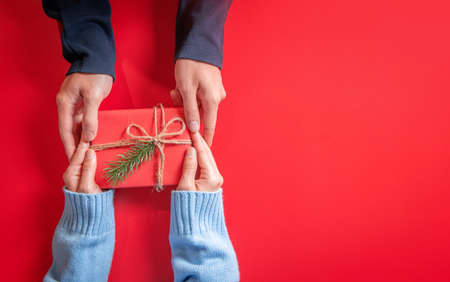 Gives a gift Christmas and new year presents laid on a red background. copy space. top view.
