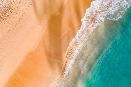 Summer seascape from drone. Tropical beach and waves, Turquoise water abstract background from top view. Vacation Travel and idea concept.の写真素材