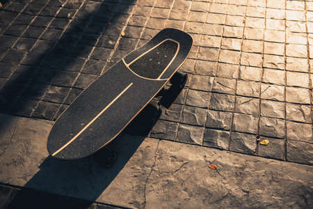 Close up surf skate or skateboard at park sunsetの写真素材