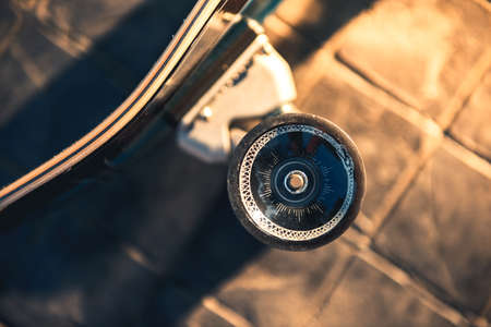 Close up wheel of surf skate or skateboard at park sunset.の写真素材
