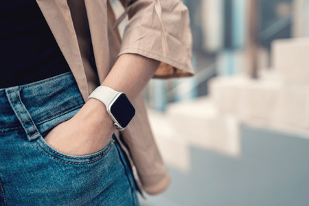 Hands of woman wearing trendy smart watch. Gadget that lets you always stay connected to internet. copy space.の写真素材