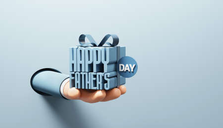 Hand holding Happy father`s day in gift box wrapped with ribbon on blue background, idea and...