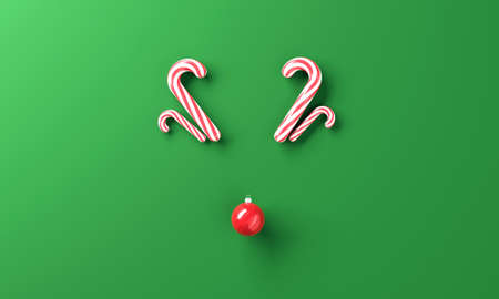 Minimal reindeer made from candy and Christmas ball with merry Christmasの写真素材