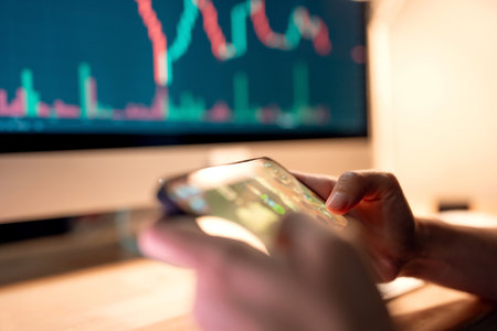 Close-up - Hands of woman playing blockchain nft game in mobile phone on price chart digital exchange background, Play to earn cryptocurrency rewards.の写真素材