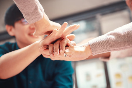 Close up - Team of united business people putting their strong hands together. Unity and successful teamwork concept.の写真素材