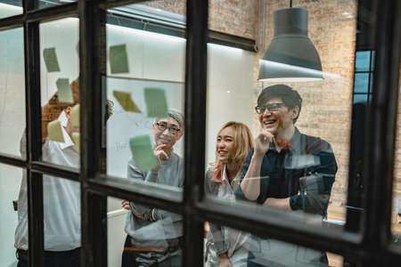 Closeup - Business asian people meeting at office and use  notes to plan and share idea. Brainstorming conceptの写真素材