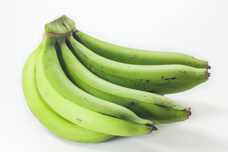 green bananas isolated on white backgroundの写真素材