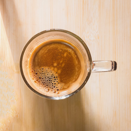 cup of fresh espresso on table, view from aboveの写真素材