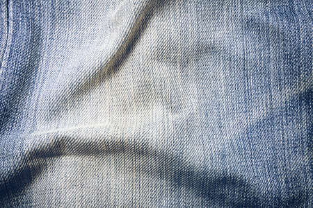 Texture of blue jeans textile close upの写真素材
