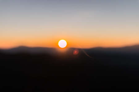 mountains at sunset in blurred backgroudの写真素材