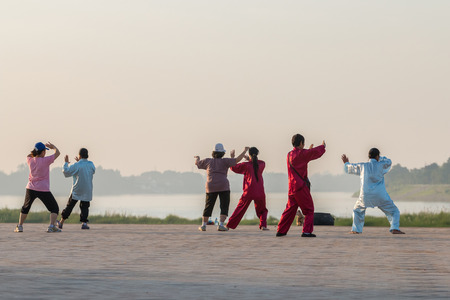 Vientiane, Laos - Oct. 31,2015: People exercise  Tai Chi in morning at edge Mekong River,Oct 31, Vientiane, Laosのeditorial素材