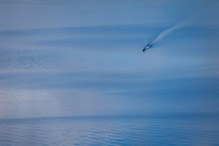 A man riding the boat in the lake