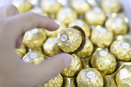 Bangkok Thailand- FEBRUARY 07, 2016: Ferrero Rocher is a chocolate sweet made by Italian Ferrero Spa. Rocher comes from French and means "rock" after a grotto in the Roman Catholic shrine of Lourdes.のeditorial素材