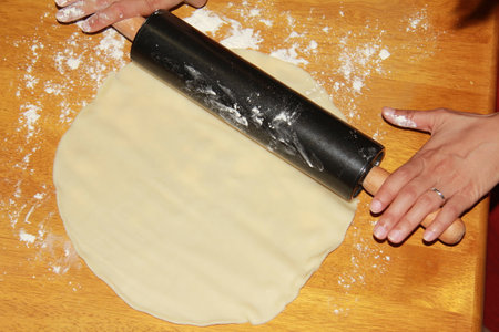 Rolling a pie doughの写真素材
