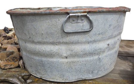 bucket on wooden table with rocksの写真素材