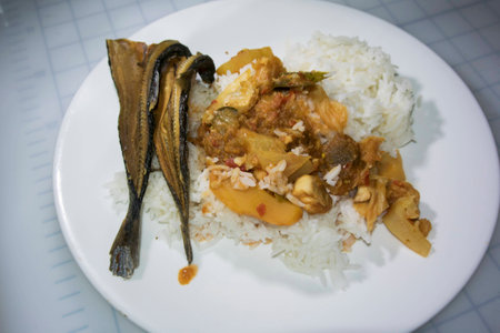 rice with dry crunchy fish and sour curryの写真素材