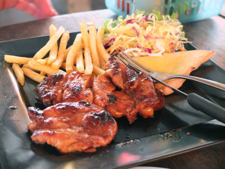 Chicken grill steak  with french fried and saladの写真素材