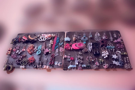 earrings hanging on black sheetの写真素材