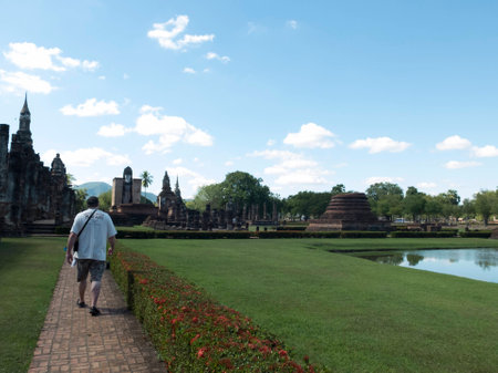 a man walks at Sukhothai Historic Parkの写真素材