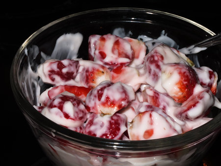 strawberries and yogurt in a bowlの写真素材