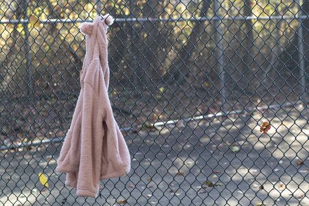 jacket hangs on the fenceの写真素材