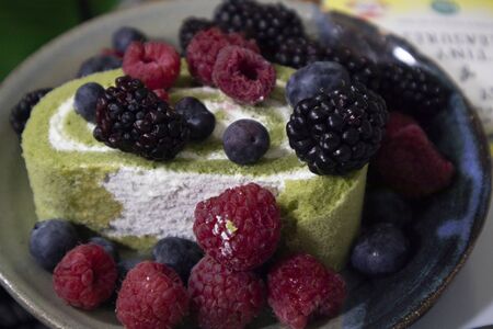 cake roll with berries fruitの写真素材