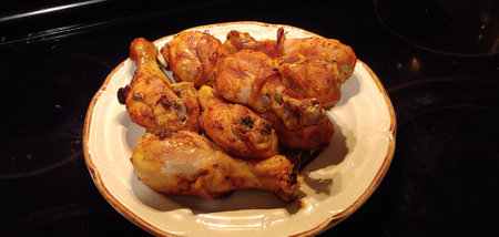 Roast chicken on a plate in a restaurant, close-upの写真素材