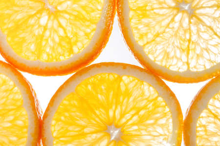 Abstract background with citrus-fruit of orange slices. Close-up. Studio photography.