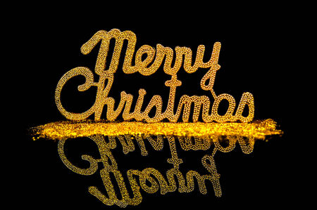 Christmas background character gold on black backgroundの写真素材