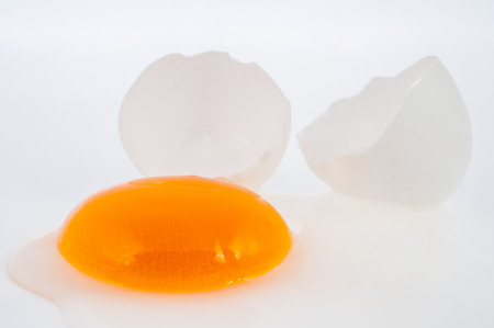 Broken egg isolated on white backgroundの写真素材