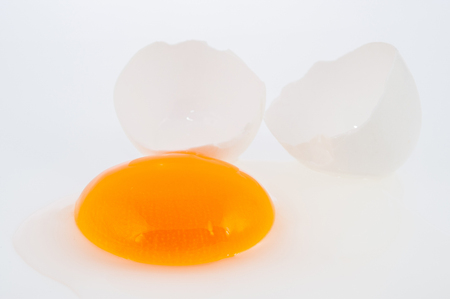 Broken egg isolated on white backgroundの写真素材