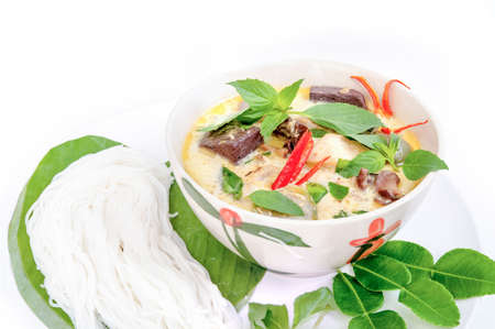 rice noodles served with Chicken Green Curry.の写真素材