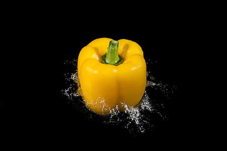 Colorful bell pepper vegetable on black backgroundの写真素材