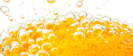 fresh orange with bubbles in the waterの写真素材