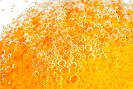 fresh orange with bubbles in the waterの写真素材
