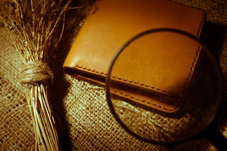magnifying glass hand made wallet made of leather Vintage Styleの写真素材
