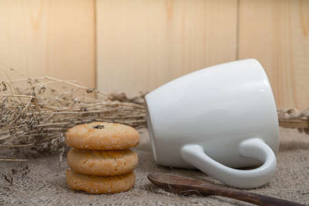 Cookies with a glass of milk with spoon on sackcloth Vintage Styleの写真素材