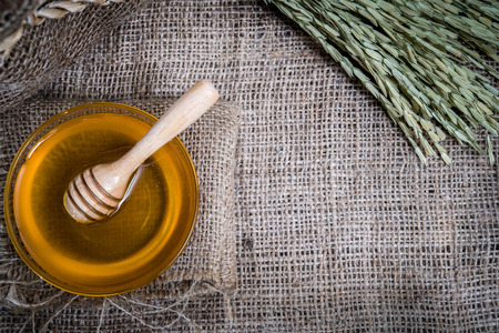 cup honey on sackcloth Vintage Styleの写真素材