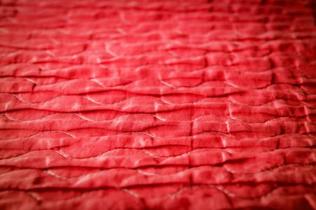 The red fabric that looks like a wave and glossiness. focus of Selection for textures and backgroundsの写真素材