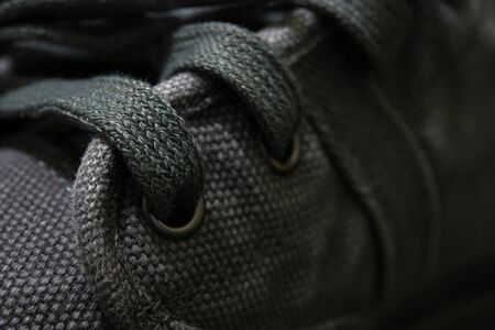 close-up hole shoelace a gray boots/vintage style.の写真素材