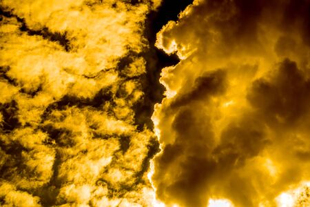 Smog cloud that looks like a hot flame/golden abstract for background.の写真素材