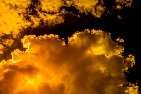 Smog cloud that looks like a hot flame/golden abstract for background.