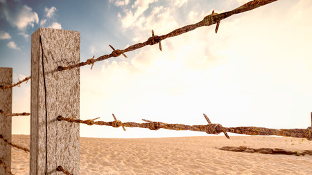 Old barbed wire mounted on wooden poles 3d render. It's like a barrier to work or travel.の写真素材