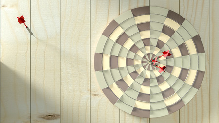 Darts hitting in the target center 3d render,Business conceptの写真素材
