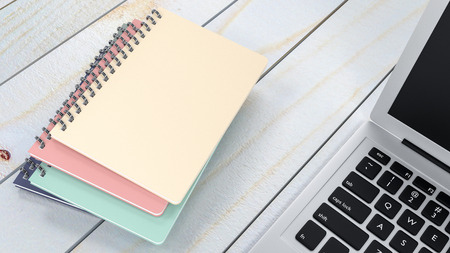 Notebook with laptop on wood table 3d render
