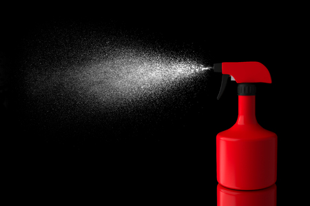 Spraying liquid isolated red color on black backgroundの写真素材