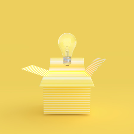 The light bulb drifted out of the gift box yellow color and clipping path. New idea and innovation concept and minimal style, 3D Render.の写真素材
