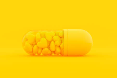 Capsules, inside which are filled with many yellow hearts. Minimal and Love background idea concept,...