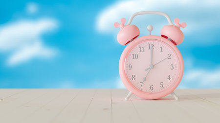 Pink clock at 7.00 on wooden table and bright sky background.  Selective focus and copy space for...